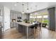 Well-lit kitchen with stainless steel appliances and a view to the backyard at 16648 W 92Nd Pl, Arvada, CO 80007