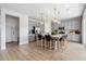 Bright kitchen with a large island, stainless steel appliances, and ample cabinet space at 16648 W 92Nd Pl, Arvada, CO 80007