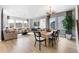 Bright living and dining area with hardwood floors, stylish decor, and a cozy atmosphere at 16648 W 92Nd Pl, Arvada, CO 80007