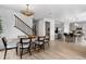 Spacious open concept design with dining area flowing into a modern kitchen with a large island at 16648 W 92Nd Pl, Arvada, CO 80007