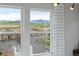 Breathtaking view from the window shows mountains and a field that will become new homes at 16648 W 92Nd Pl, Arvada, CO 80007