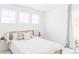 Bright bedroom with large windows and a comfortable-looking bed with decorative pillows at 6117 Easton Cir, Frederick, CO 80504