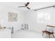 A bright and spacious bedroom with natural light, modern furniture, and minimalist decor at 6117 Easton Cir, Frederick, CO 80504