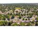 Scenic aerial view of the residential neighborhood with mature trees and community amenities at 3055 S Winona Ct, Denver, CO 80236