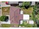 Aerial shot of the home's roof and backyard with storage buildings and carport at 3055 S Winona Ct, Denver, CO 80236