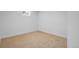 Carpeted basement area with a window, and white walls at 3055 S Winona Ct, Denver, CO 80236