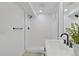 Bathroom featuring a shower, a floating vanity and modern fixtures at 3055 S Winona Ct, Denver, CO 80236