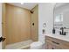 Modern bathroom boasts a glass-enclosed shower and a stylish vanity at 3055 S Winona Ct, Denver, CO 80236