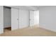 Bedroom featuring a closet with sliding doors and white trim at 3055 S Winona Ct, Denver, CO 80236
