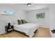 Bright bedroom with white walls, wood floors and large windows at 3055 S Winona Ct, Denver, CO 80236