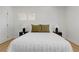 Bright bedroom features a comfortable bed with side tables and lamps at 3055 S Winona Ct, Denver, CO 80236