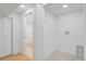 Laundry area featuring access to the bathroom, washer hookups and tile floor at 3055 S Winona Ct, Denver, CO 80236