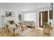 Inviting living room with a brick fireplace, natural light, and comfortable seating at 3055 S Winona Ct, Denver, CO 80236