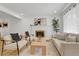 Bright living room showcasing a cozy seating area, hardwood floors, and stylish decor at 3055 S Winona Ct, Denver, CO 80236