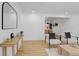 Bright living room with hardwood floors, modern decor, and an open floor plan at 3055 S Winona Ct, Denver, CO 80236