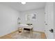 Bright office space with a modern desk and a view from the window at 3055 S Winona Ct, Denver, CO 80236