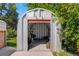 Shot of storage building with open red door showing items stored inside at 3055 S Winona Ct, Denver, CO 80236