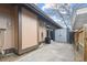 View of backyard patio featuring storage shed and partial fence on a sunny day at 3746 S Fairplay Way, Aurora, CO 80014