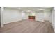 Spacious finished basement featuring hardwood floors and a wet bar area at 3746 S Fairplay Way, Aurora, CO 80014