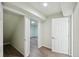 A finished basement hallway with hardwood floors leading to other rooms at 3746 S Fairplay Way, Aurora, CO 80014