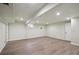 Finished basement area with hardwood floors, recessed lighting, and neutral walls at 3746 S Fairplay Way, Aurora, CO 80014