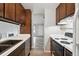 Spacious kitchen with modern appliances, ample counter space, and seamless access to dining at 3746 S Fairplay Way, Aurora, CO 80014