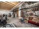 Unfinished basement with exposed beams, providing ample storage space and potential for customization at 16317 Saint Paul St, Thornton, CO 80602