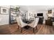 Open-concept living space with dining area flowing into the living room, perfect for modern living and entertaining at 16317 Saint Paul St, Thornton, CO 80602