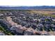 An aerial view of a neighborhood surrounded by beautiful mountain views in the distance at 11299 Star Streak Ln, Littleton, CO 80125
