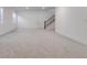 Finished basement featuring neutral walls and carpet and a wooden staircase for easy access at 11299 Star Streak Ln, Littleton, CO 80125