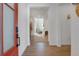 Bright entryway with hardwood floors leading into a living room with a fireplace at 11299 Star Streak Ln, Littleton, CO 80125