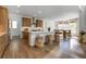 Bright kitchen with ample counter space, a large island with seating, wood cabinets and stainless steel appliances at 11299 Star Streak Ln, Littleton, CO 80125