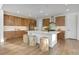 Spacious kitchen with custom wood cabinets, large center island, and modern appliances perfect for entertaining at 11299 Star Streak Ln, Littleton, CO 80125