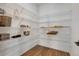 Pantry with wire shelving, hardwood floors and white walls at 11299 Star Streak Ln, Littleton, CO 80125