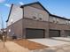 Rear exterior view of gray townhomes at 754 N Tempe St, Aurora, CO 80018