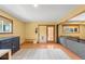 Spacious finished basement with natural light, laminate flooring and a comfortable lounging area at 10090 Blue Sky Trl, Conifer, CO 80433