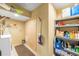 Well-organized basement storage area with shelving, closet, laundry area, and plenty of space at 10090 Blue Sky Trl, Conifer, CO 80433