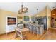 Open-concept kitchen with wood floors, custom copper sink, bar seating and stainless steel appliances at 10090 Blue Sky Trl, Conifer, CO 80433