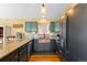 Charming kitchen with custom copper sink, granite countertops and matching stainless steel appliances at 10090 Blue Sky Trl, Conifer, CO 80433