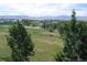 View of a sprawling green space near commercial buildings, perfect for enjoying nature close to work at 431 Wright St # 203, Lakewood, CO 80228