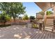 View of deck, stairs and backyard fenced in for privacy with mature trees and shrubs at 12674 E Bates Cir, Aurora, CO 80014