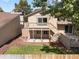 Lovely backyard featuring a wood fence, trees, and two decks at 12674 E Bates Cir, Aurora, CO 80014
