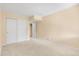 Spacious bedroom features carpeted floors, a trim, and a double-door closet at 12674 E Bates Cir, Aurora, CO 80014
