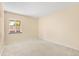 Carpeted bedroom with a window offering natural light and a view at 12674 E Bates Cir, Aurora, CO 80014
