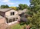 An aerial view of a two-story home with a deck and lush backyard, perfect for outdoor living at 12674 E Bates Cir, Aurora, CO 80014