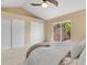 Cozy main bedroom with vaulted ceilings, soft carpet, closet doors and glass doors to the outdoor patio at 12674 E Bates Cir, Aurora, CO 80014