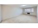 Spacious bedroom features neutral walls, carpet, and a window at 675 S Alton Way # 7A, Denver, CO 80247
