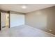 Neutral bedroom features a large closet and neutral carpeting at 675 S Alton Way # 7A, Denver, CO 80247