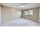 Spacious bedroom with neutral paint, carpet, and a large window at 675 S Alton Way # 7A, Denver, CO 80247