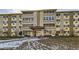 Well-maintained building offers convenient living with a welcoming entrance and lush landscaping at 675 S Alton Way # 7A, Denver, CO 80247